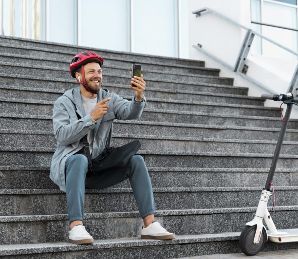 man-taking-break-after-riding-his-scooter